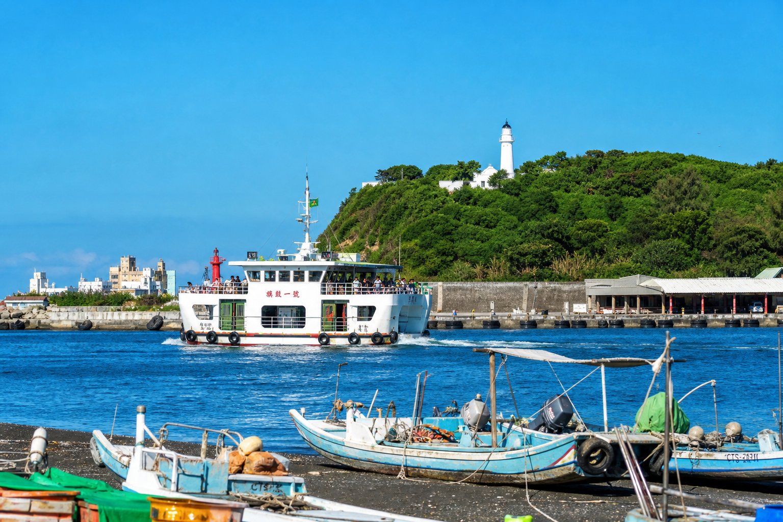Qijin ferry crossing Kaohsiung Harbor with the white Cihou Lighthouse on the green hill, black-sand beach and fishing boats in the foreground